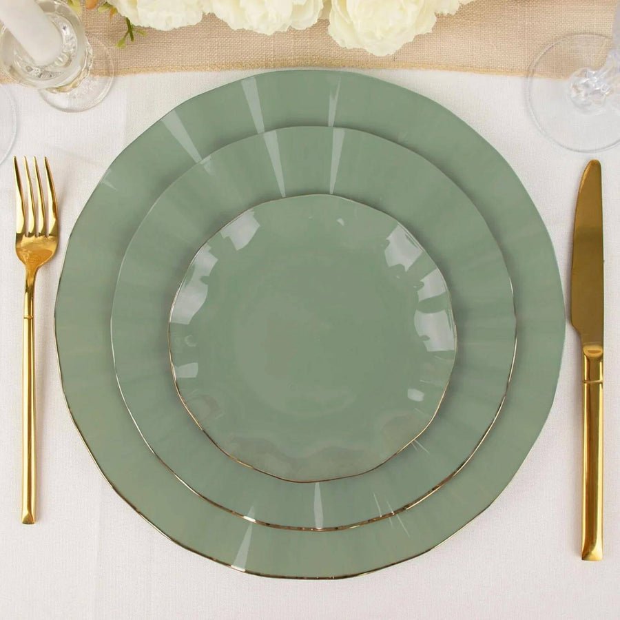 Navy blue plastic dinner plate with an elegant gold rim. Disposable tableware for wedding receptions.