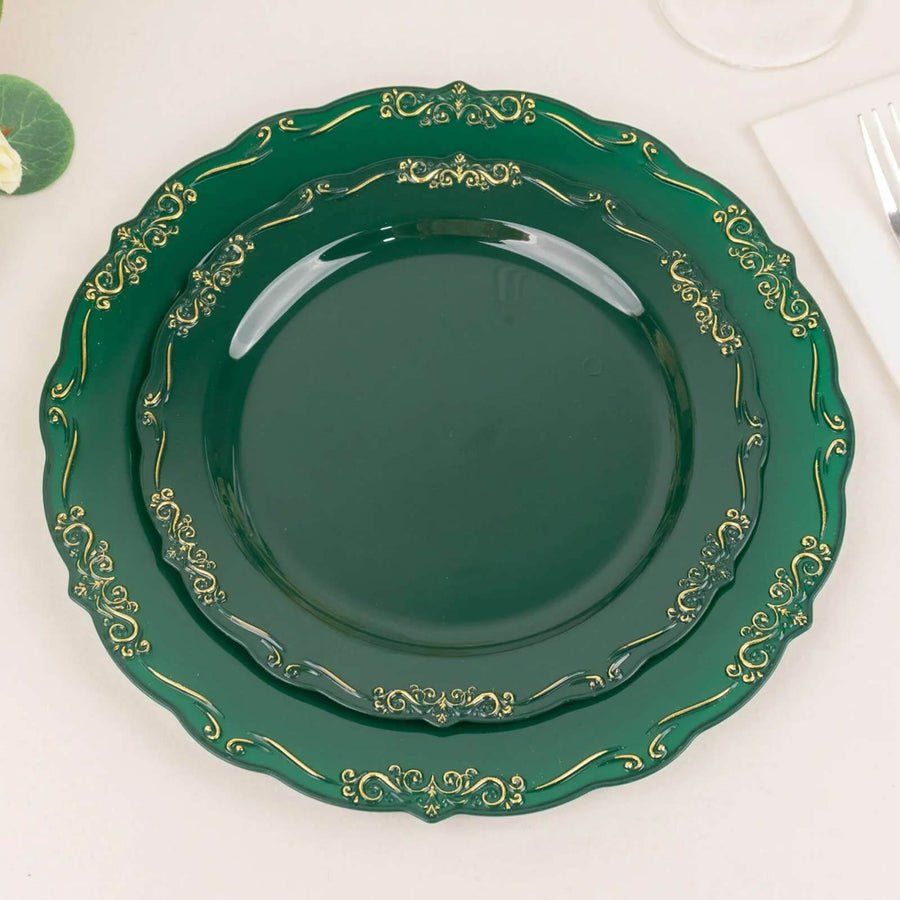 Clear plastic dinner plate with gold baroque rim. Elegant disposable tableware for wedding or parties.