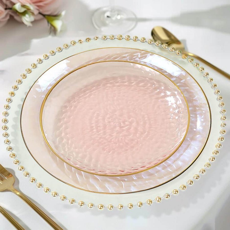 Clear beaded charger plate with iridescent pink hammered plastic plate. Disposable fancy wedding dinnerware.
