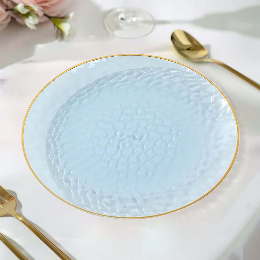 9 inch ivory hammered plastic dinner plate with gold rim. Disposable tableware for large events.