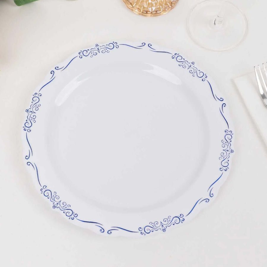 Clear disposable plastic wine cup with ornate gold rim. Luxury tableware for wedding reception.