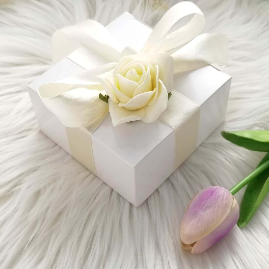 White floral favor box with gold trim. Perfect party treat or wedding gift boxes.