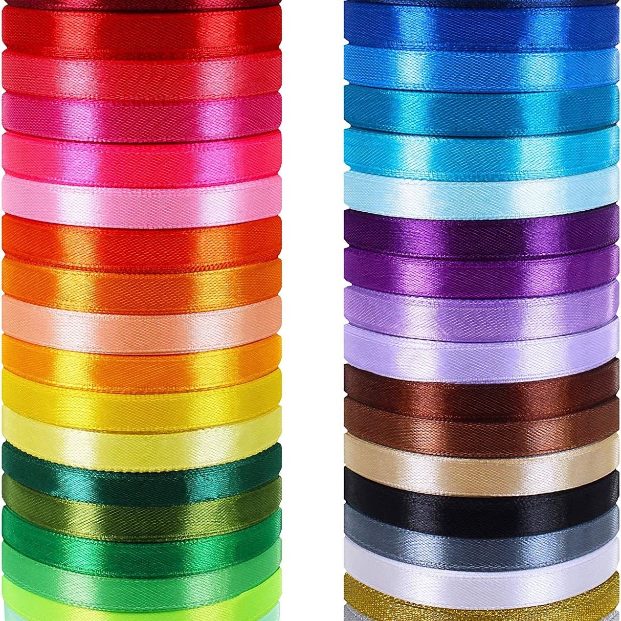 Colorful ribbon selection displaying various satin ribbon options for clear cupcake boxes. Assorted ribbon colors complement macaron favor boxes for customized party presentations.
