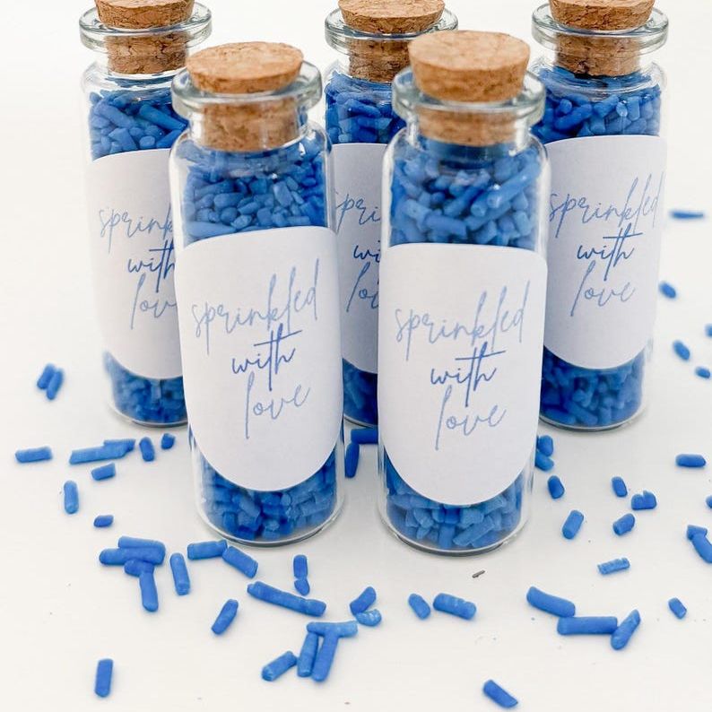 Bridal shower sprinkle favors with elegant label designs.
