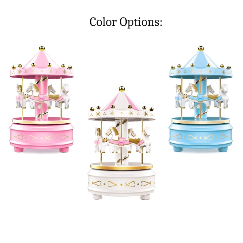 Carousel cake topper on a birthday cake with LED lights