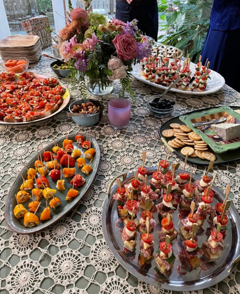 Elegant event table with charcuterie toothpicks in assorted appetizers