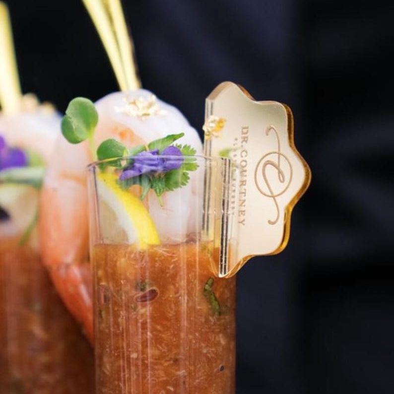 Bloody Mary or cold soup shooter elegantly served in a mini acrylic cup with garnish, showcasing the cup's versatility and upscale appeal for stylish events.