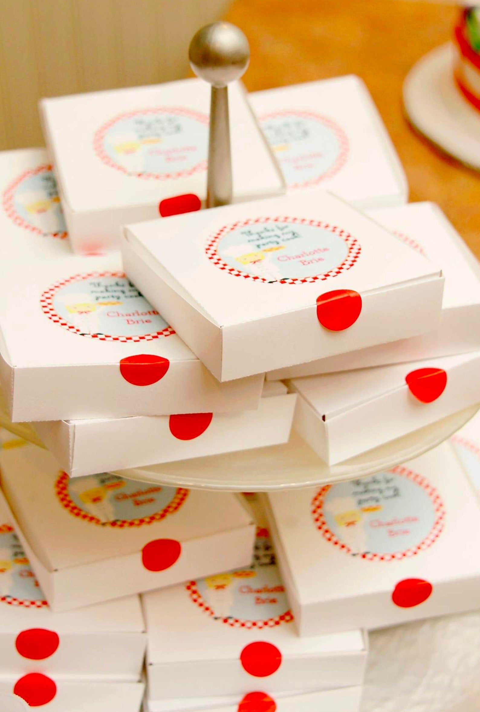 Miniature pizza boxes enhancing pizza party supplies on a dessert bar.