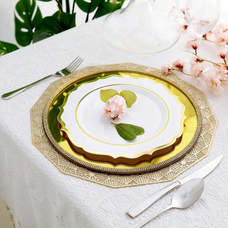 Layered gold charger and white dinner plate – luxury event table setup with floral décor