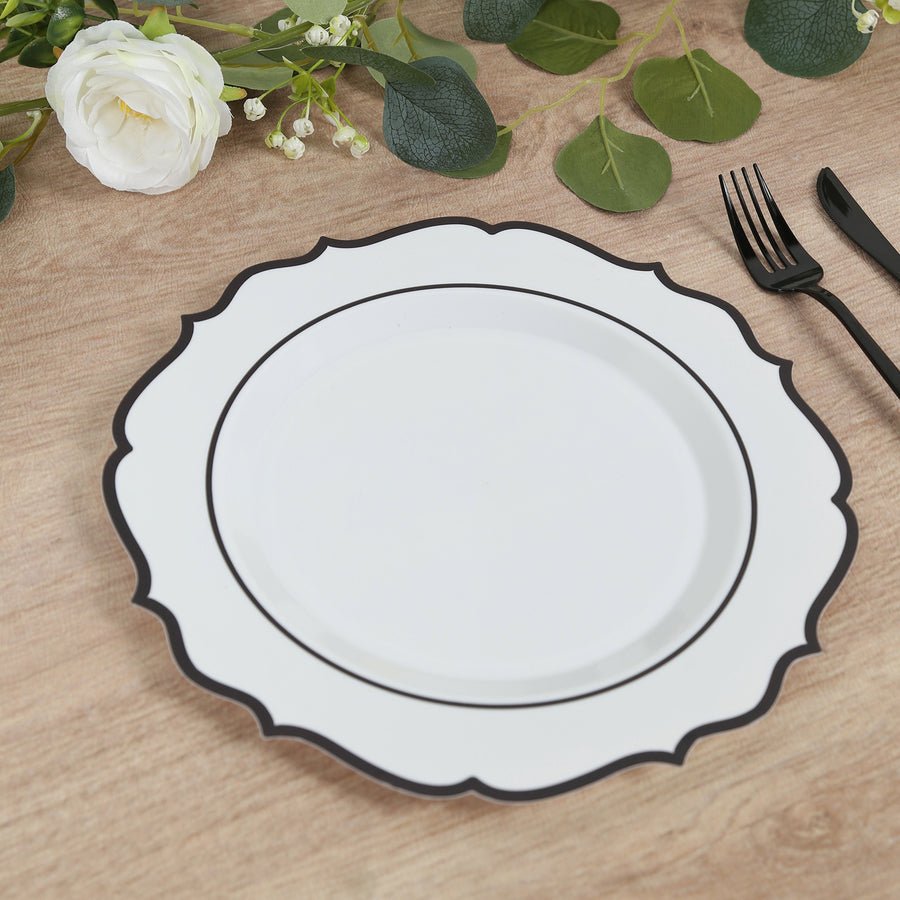 White scalloped plastic dinner plate with black rim – elegant disposable tableware for events