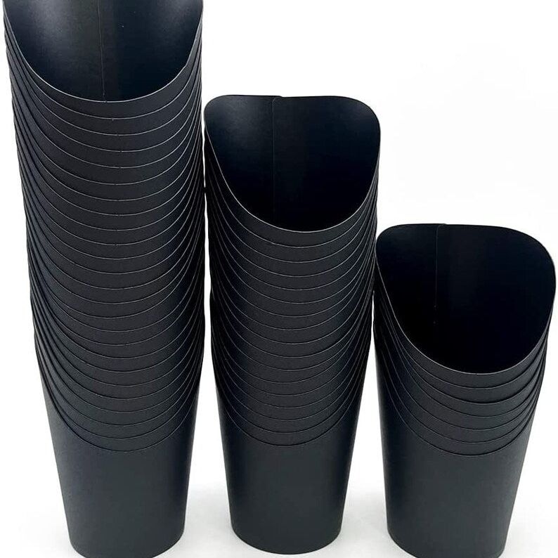 Stack of matte black paper charcuterie cups, 16oz size.