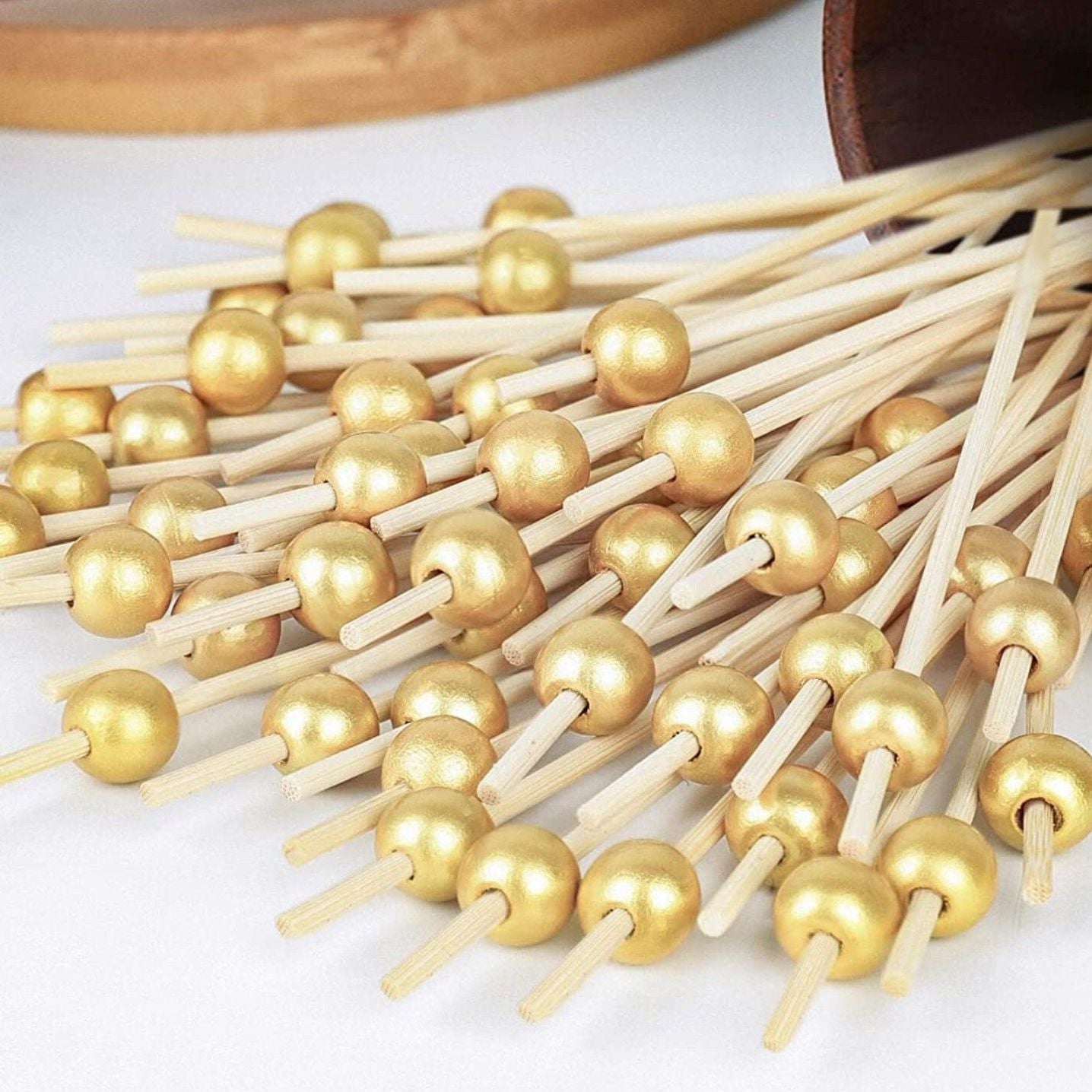 Gold fancy toothpicks for appetizers and charcuterie.