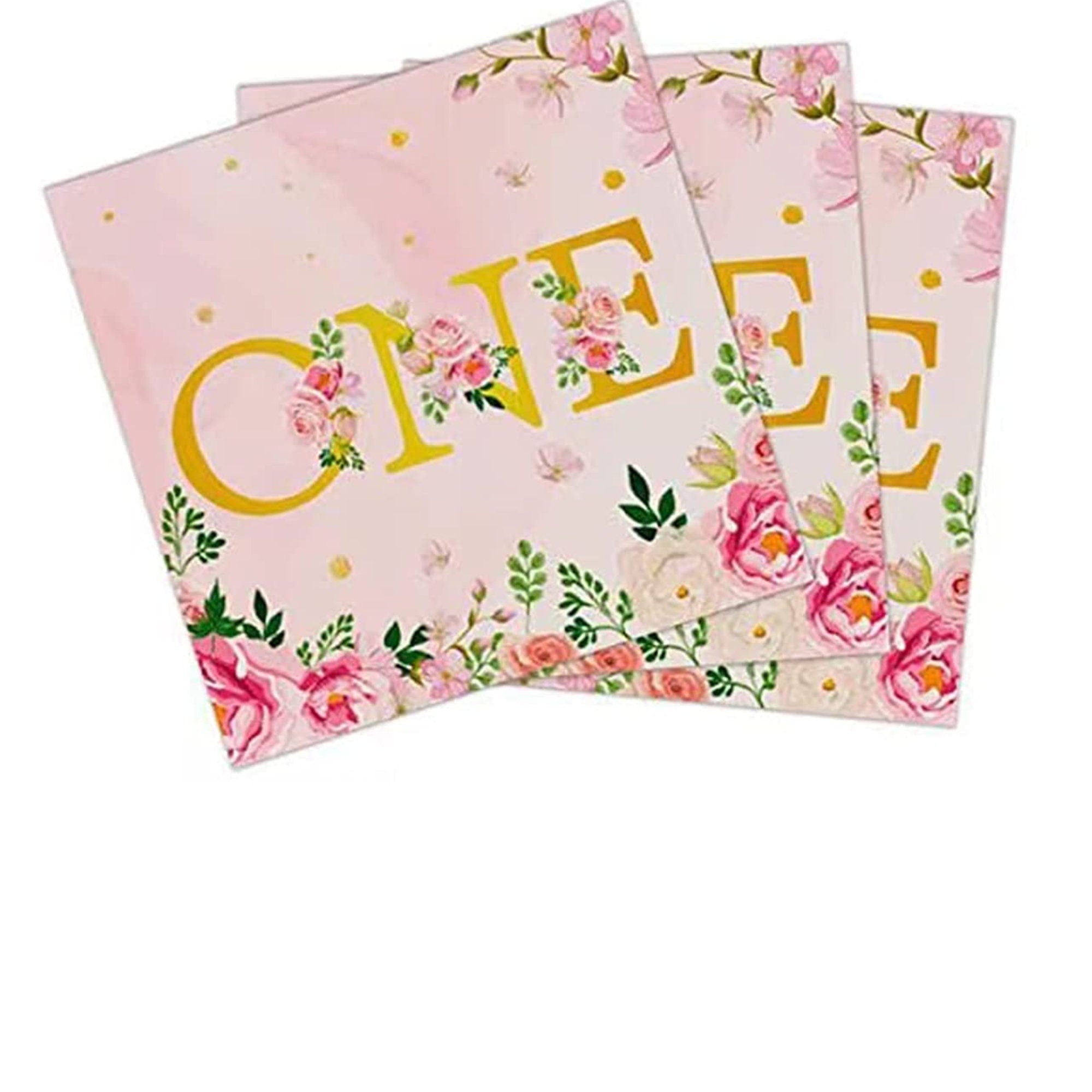First birthday napkins with coordinating pink forks arranged for party table setup