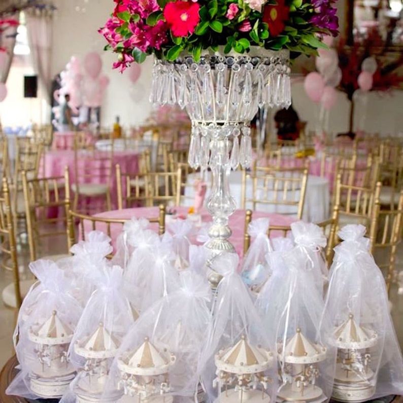 Gift-wrapped carousel horse cake toppers for party favors