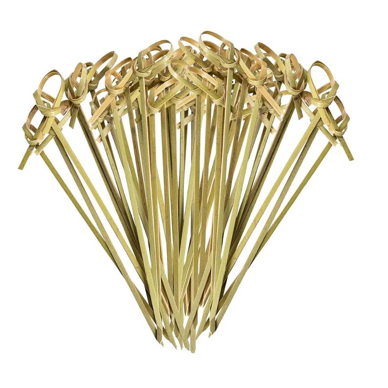 Decorative gold toothpicks grouped together, showcasing their elegant design and perfect complement to mini acrylic soup cups for stylish, upscale presentations.
