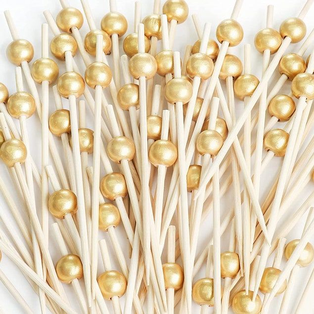 Gold pearl fancy toothpicks for appetizers and charcuterie.