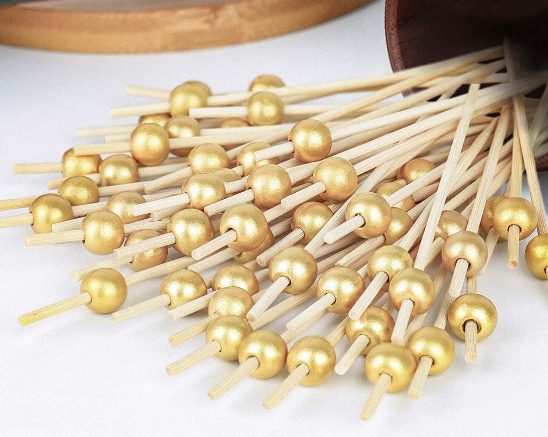 Gold pearl fancy toothpicks for appetizers and charcuterie cups.