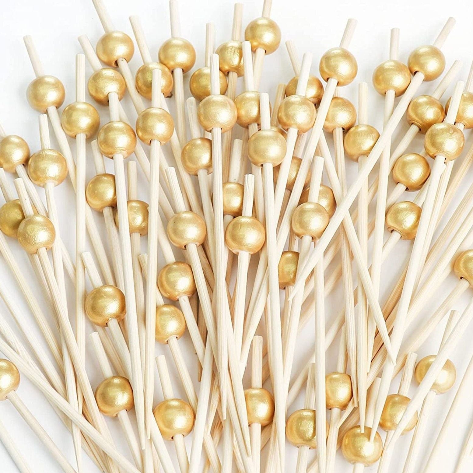 Gold pearl fancy toothpicks for appetizers and charcuterie.