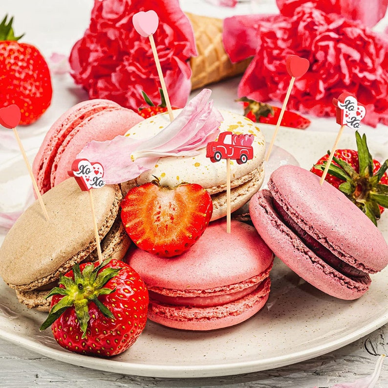 Fancy bamboo toothpicks with Valentine designs used for macarons and strawberries