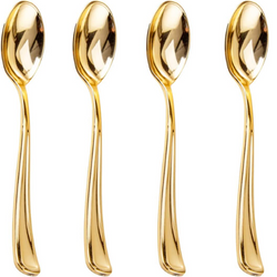 Gold spoons resting in topping bowls from hot cocoa bar kit