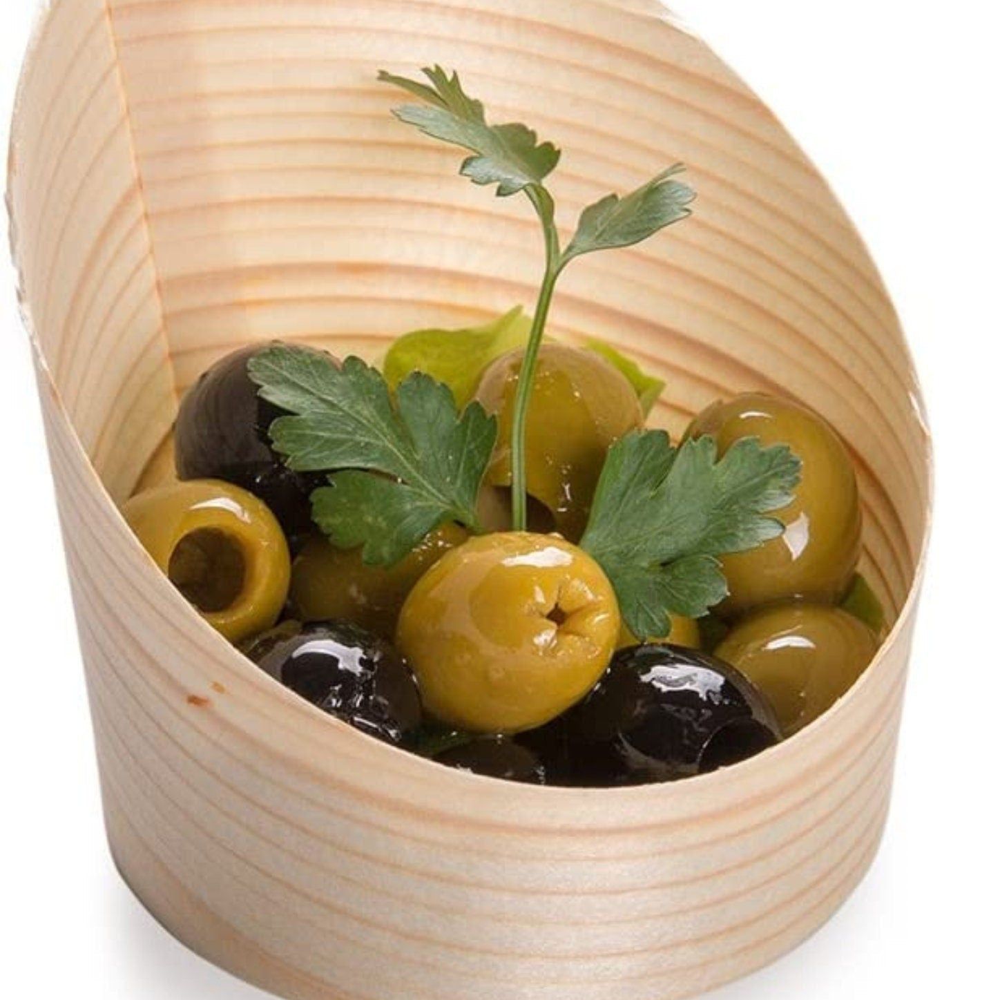Individual bamboo charcuterie cup with fancy toothpick holding olive and cheese appetizer