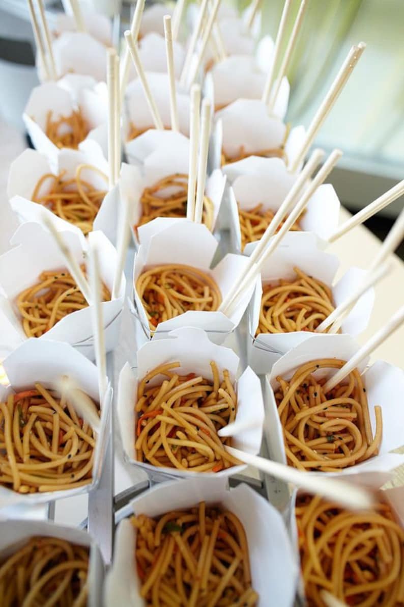 Kraft Chinese box takeout with wooden forks for appetizers and salads.