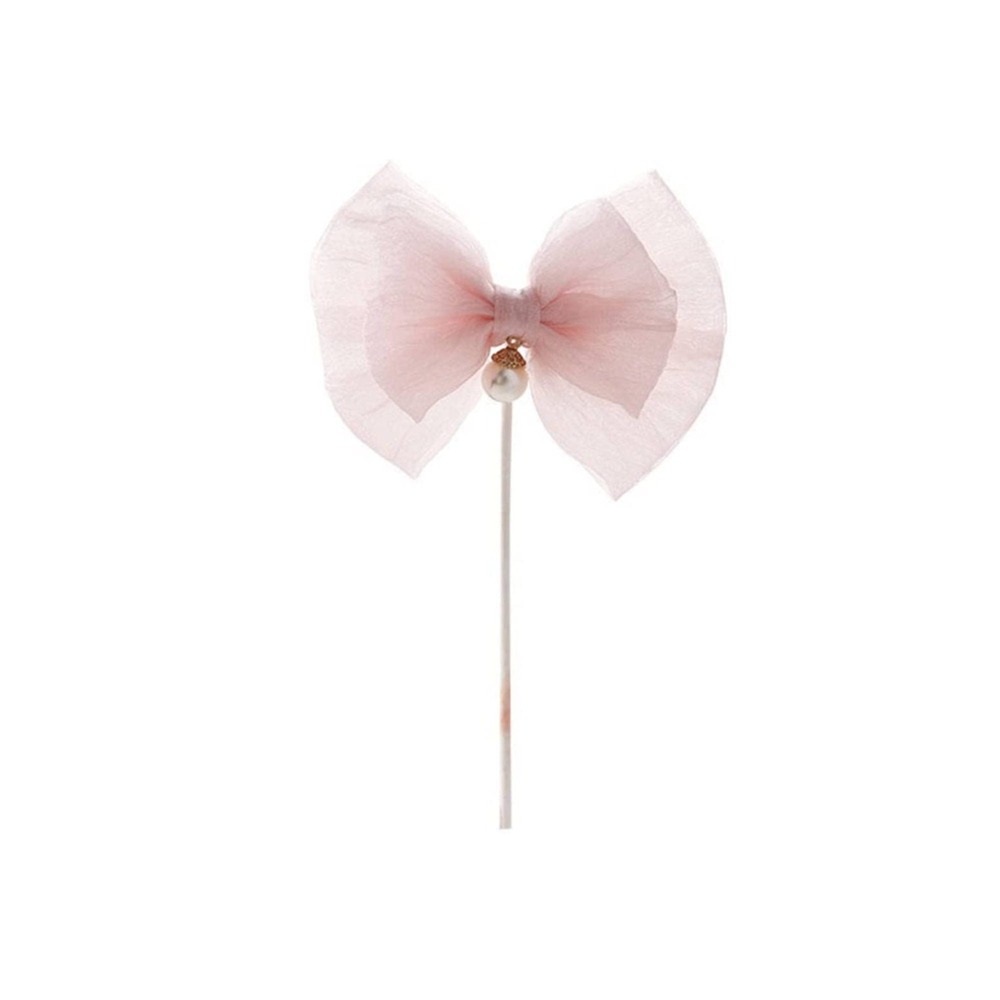 Single large tulle bow cake topper with pearl center on stick