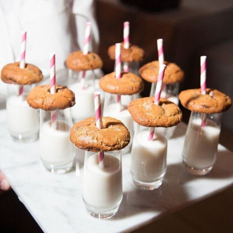 Tray of 3 oz clear acrylic dessert cups with milk and cookies and pink striped straws