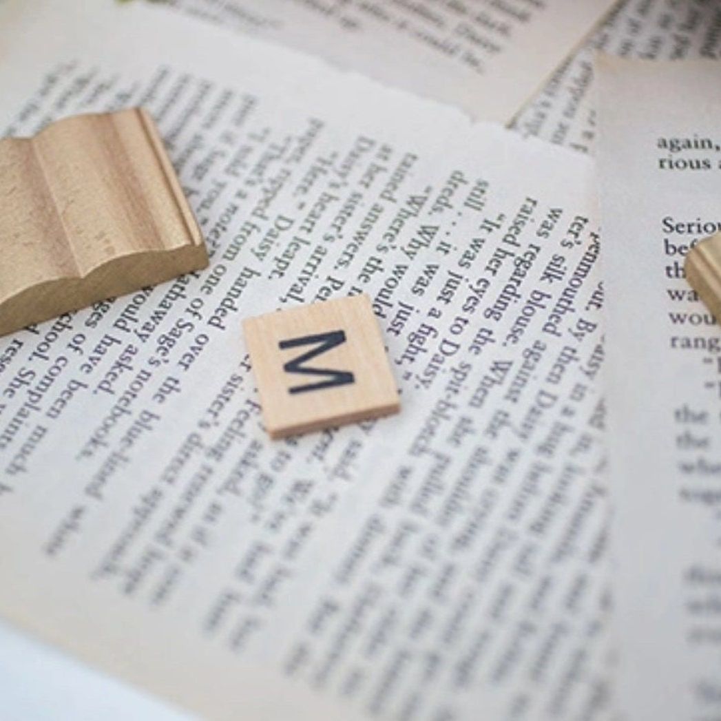 Close-up of naturally aged vintage book pages with classic printed text.
