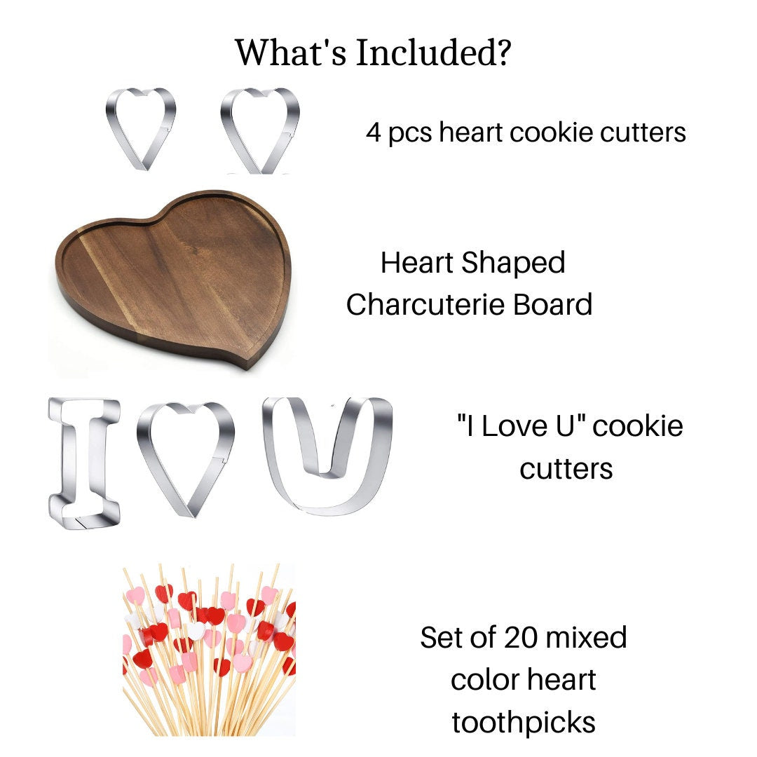Pink heart-shaped fancy toothpicks displayed on a charcuterie board.