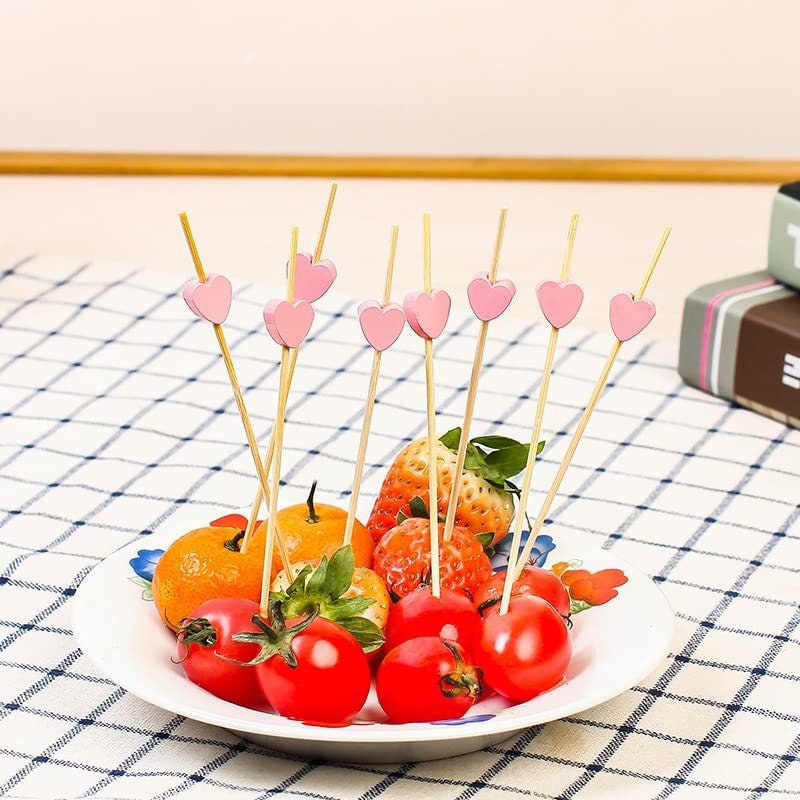 Bamboo fancy toothpicks with pink heart tops used for fruit and appetizers
