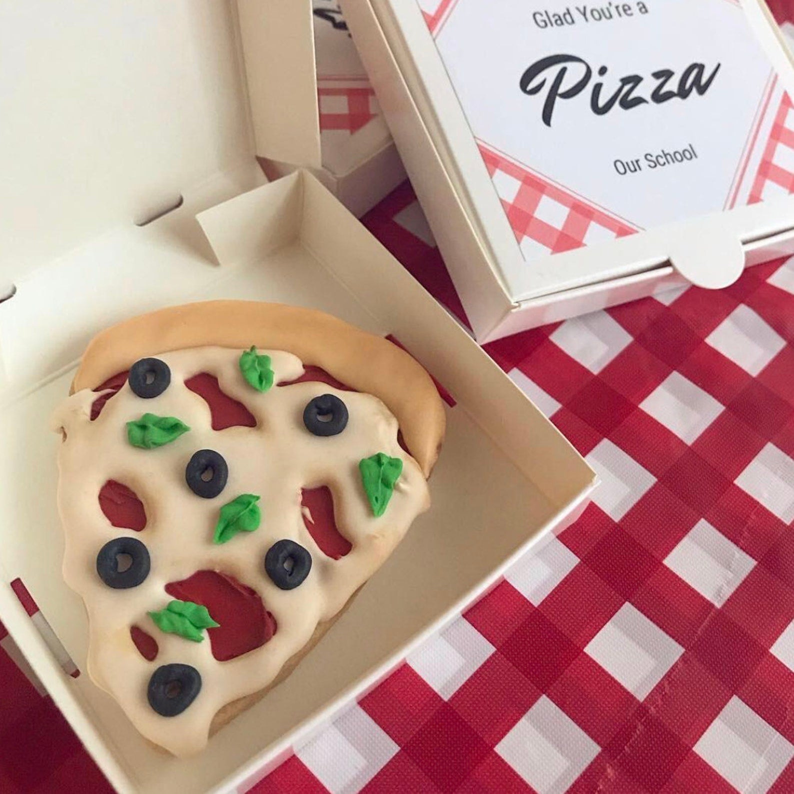 Pizza party box ready for assembly at a fun pizza-themed party.