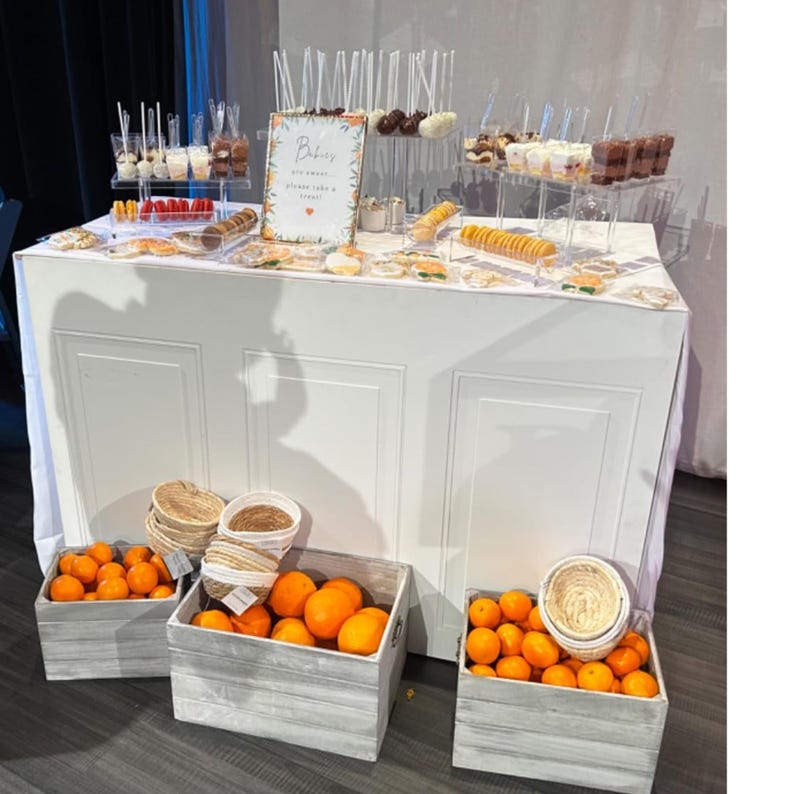 Professional acrylic dessert stand displaying layered macarons and cookies