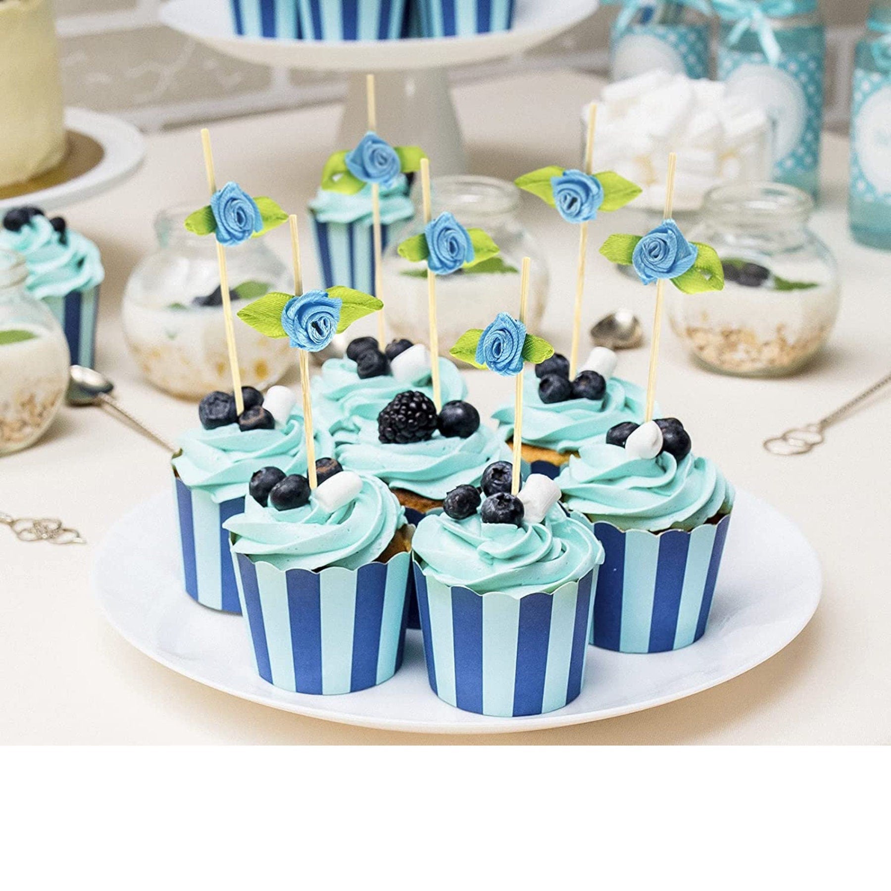 Cupcakes topped with rose charcuterie toothpicks at a wedding shower