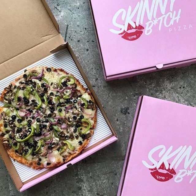 Pizza in pink mini pizza box with Skinny B*tch Pizza branding, perfect for pizza party favors and themed events.