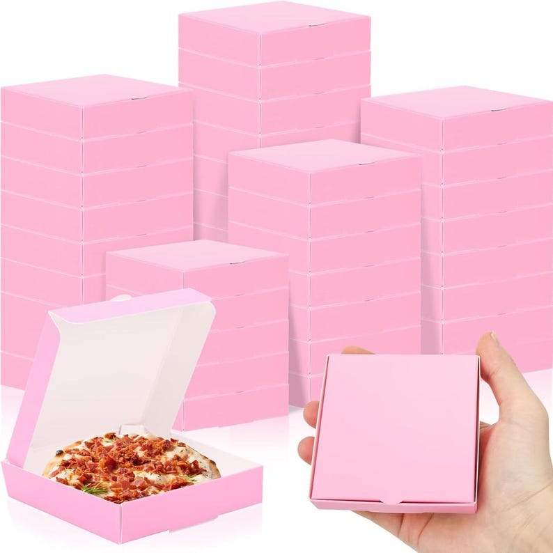 Stacked pink mini pizza boxes with one open box containing pizza, ideal for miniature pizza party favors and events.