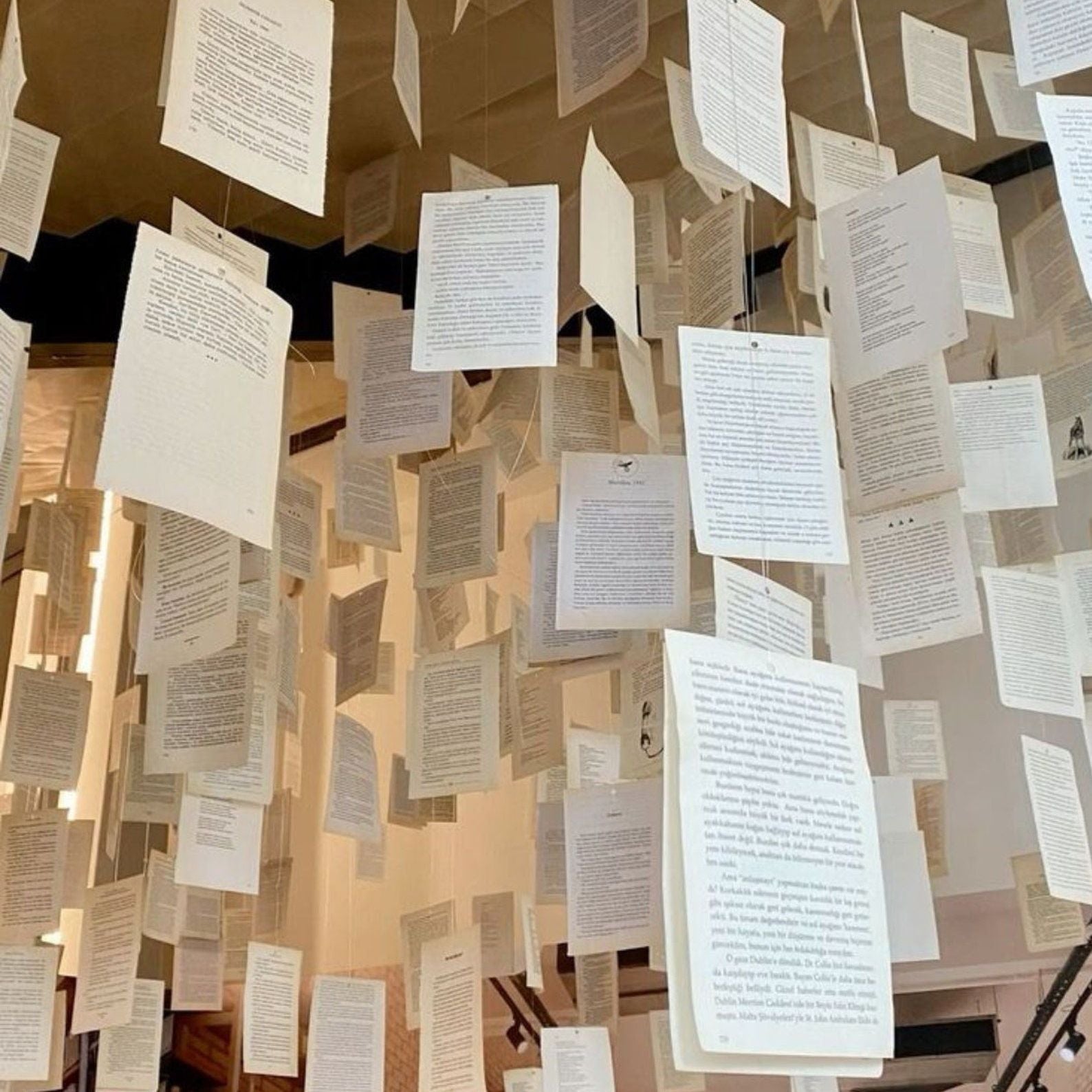 A whimsical photo backdrop of layered vintage book pages.