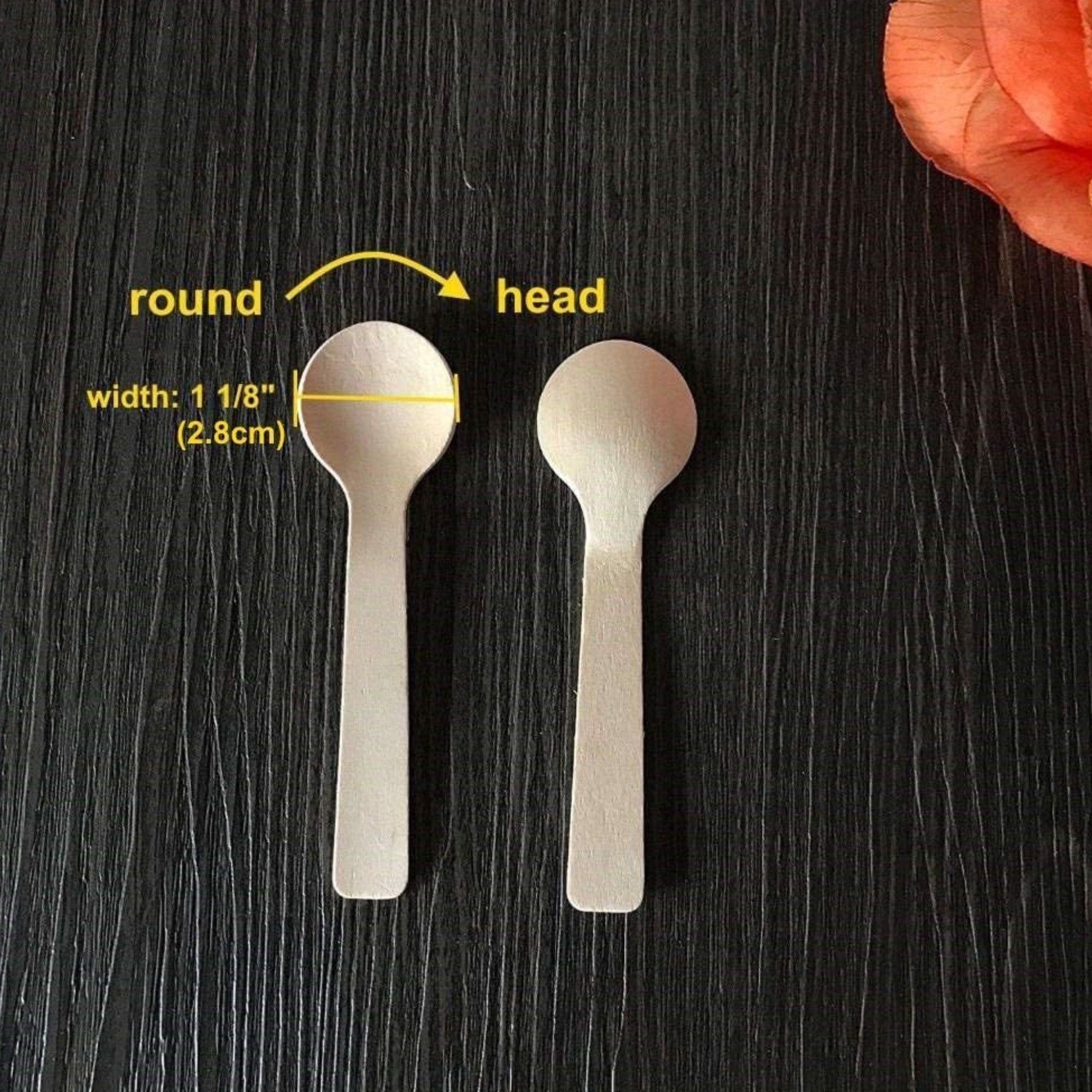 Small wooden spoon side by side with size chart