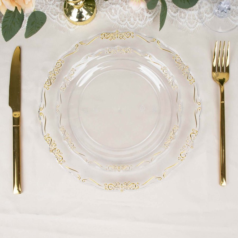 Clear baroque charger plate with gold rim and white plates. Luxury disposable wedding tableware.