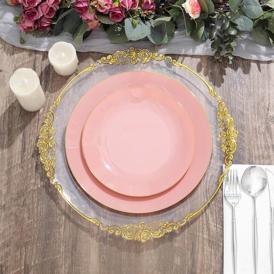 Clear plastic baroque charger plate with ornate gold rim, set with dusty blue plate. Luxury disposable dinnerware.