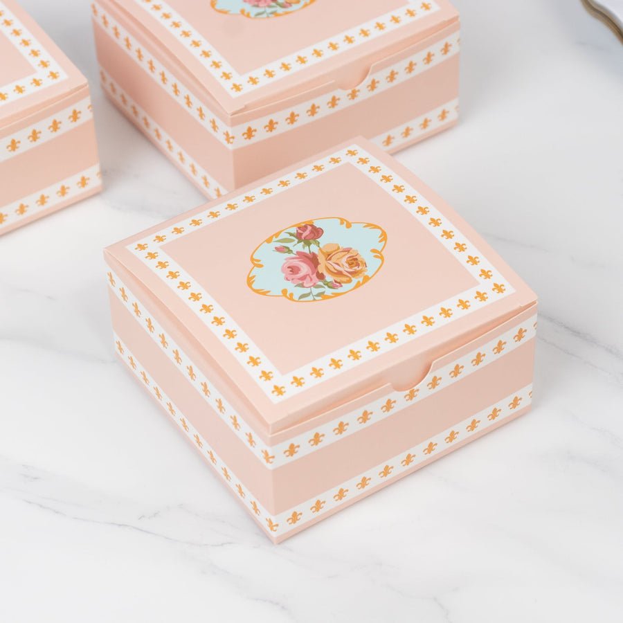Shabby chic pink floral favor boxes. Vintage-style gift packaging for weddings or parties.