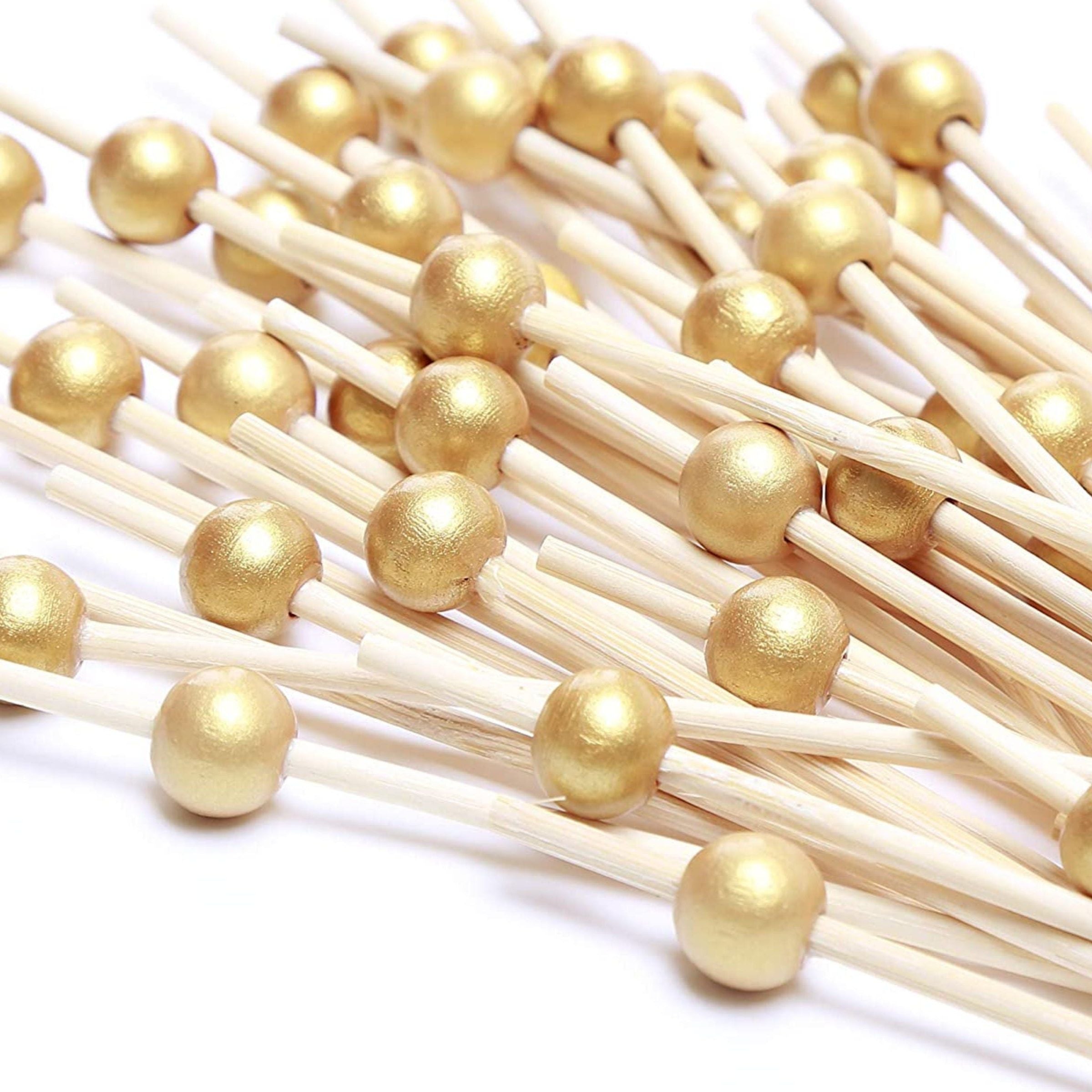 Gold appetizer toothpicks with round bead tops – elegant cocktail picks for charcuterie, cheese, and party snacks.