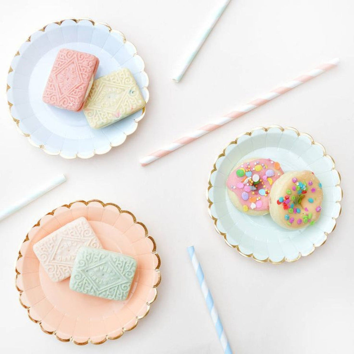 Gold trim disposable party plates in soft pastel pink, blue and mint for elegant party table settings