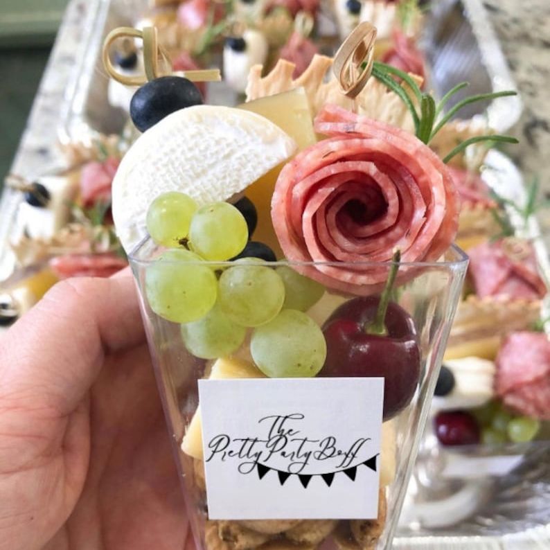 Mini fruit salad in acrylic charcuterie cup with fancy toothpick