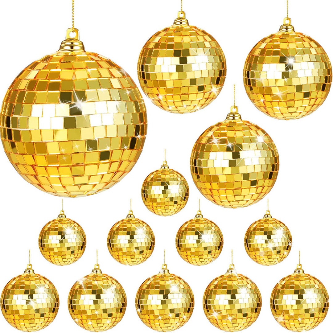 Set of 25 mini gold disco balls in varying sizes, reflecting light for dazzling mirror ball effects in stylish party setups.