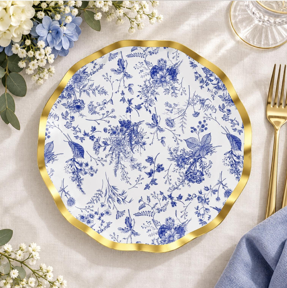 7 inch black plastic dessert plate with an ornate gold rim. Disposable tableware for cake or appetizers.