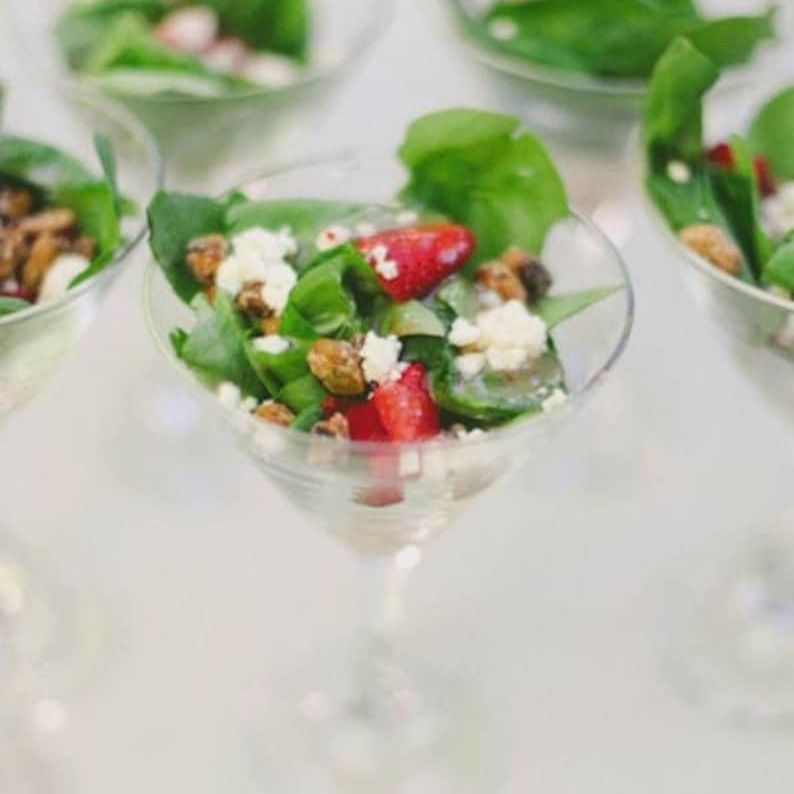 Clear acrylic salad appetizer cups with mini forks and dressing bottles