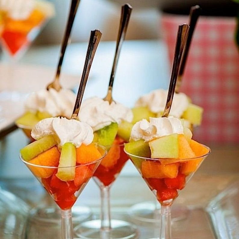 Acrylic martini appetizer cups filled with fruit and whipped cream