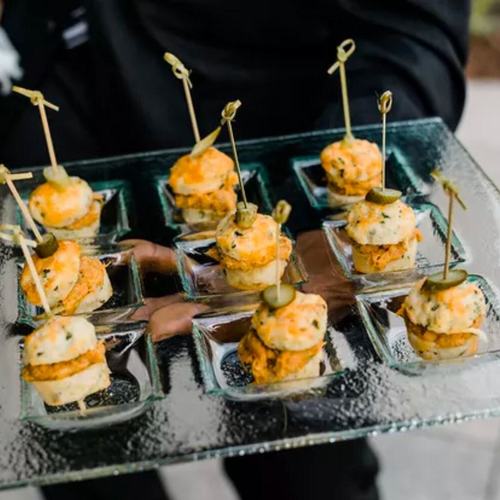 Glass appetizer trays with bamboo toothpicks on a glass tray