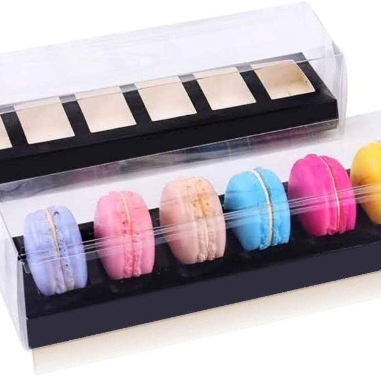 Black macaroon box with clear lid holding six colorful macarons